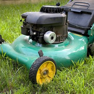 A modern lawn mower cutting through the grass